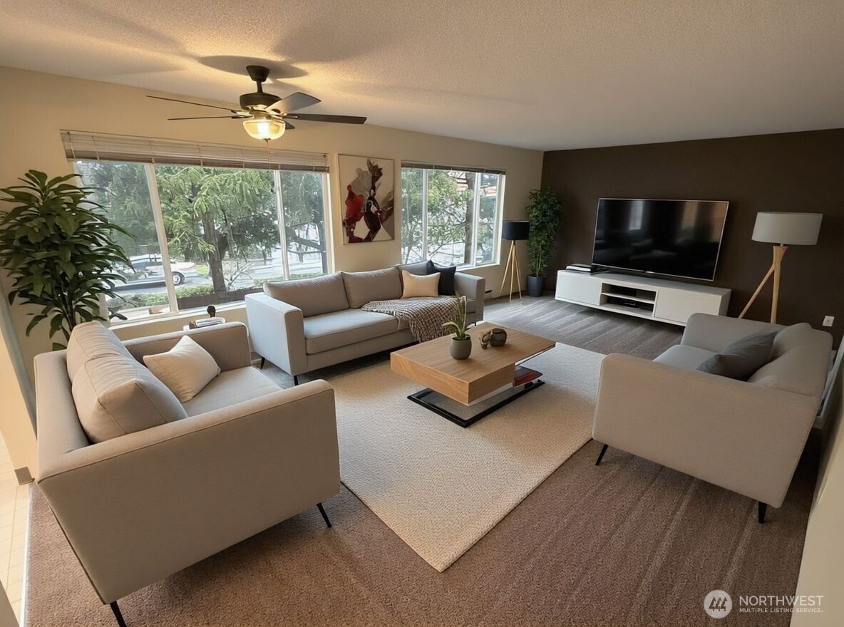 8854 Interlake Avenue North Seattle, WA 98103 - Photo 4 of 23 a living room with furniture and a flat screen tv