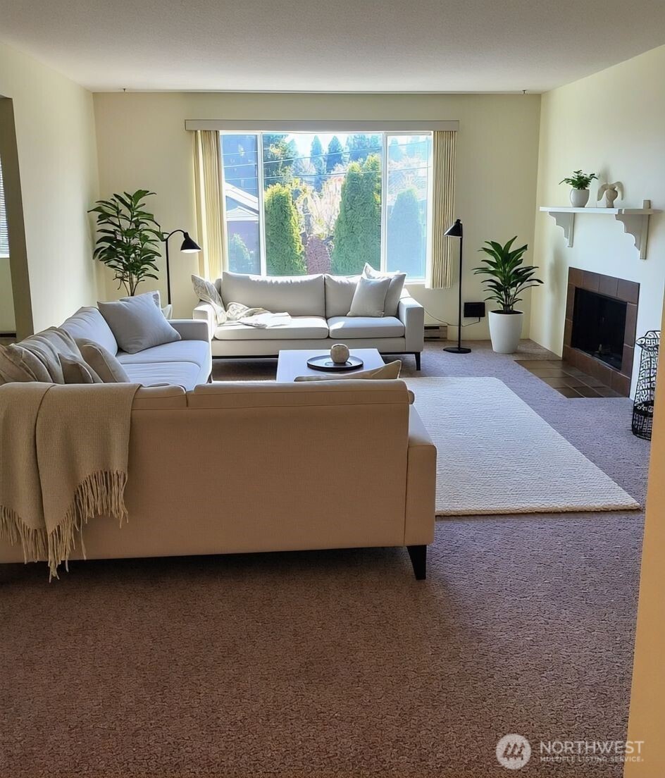 8854 Interlake Avenue North Seattle, WA 98103 - Photo 4 of 23 a living room with furniture and a fireplace