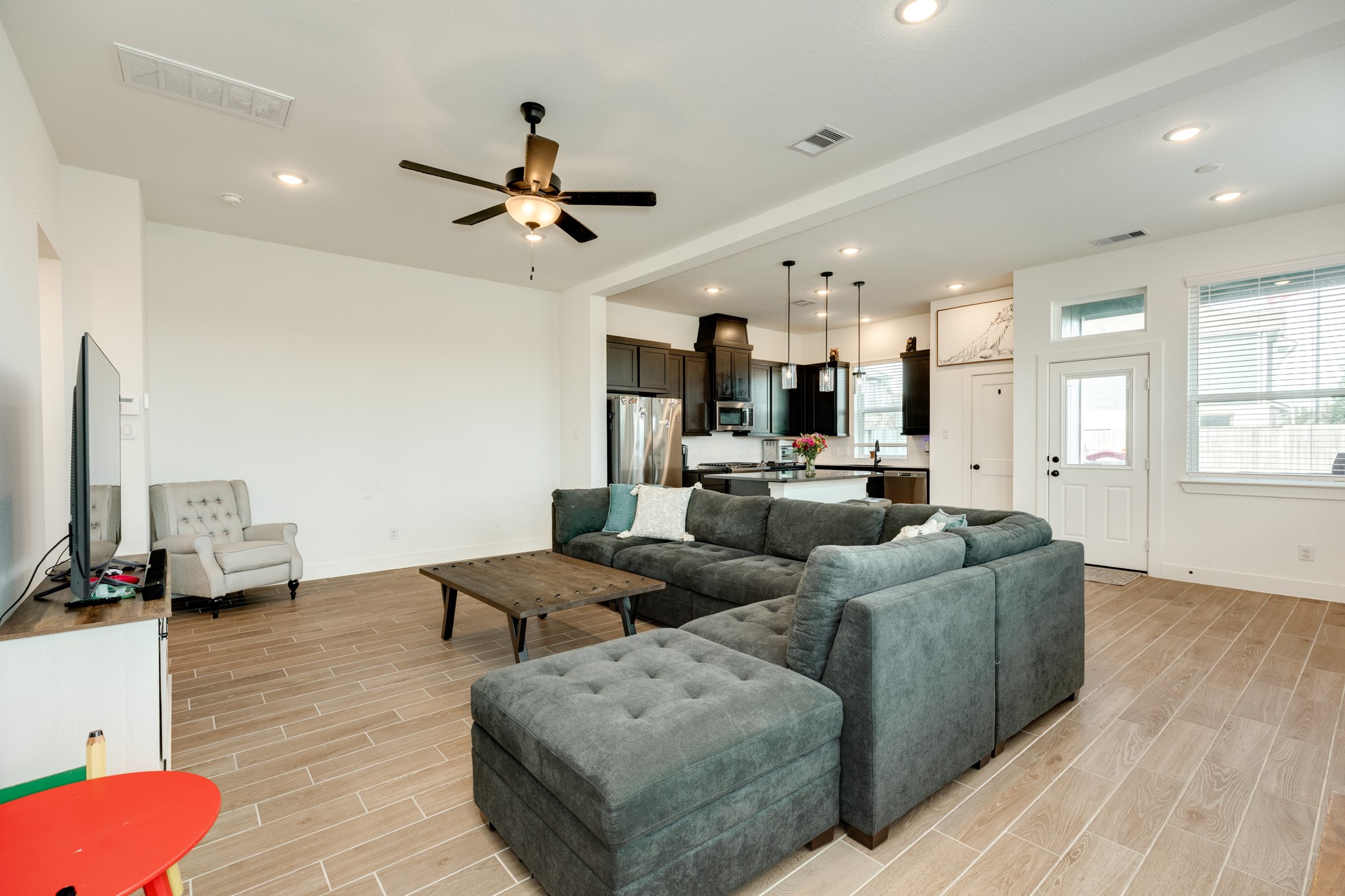 10002 Nectar Path Rosharon, TX 77583 - Photo 6 of 46 Garage entrance view with beautiful tile flooring and ample natural light from the numerous windows.