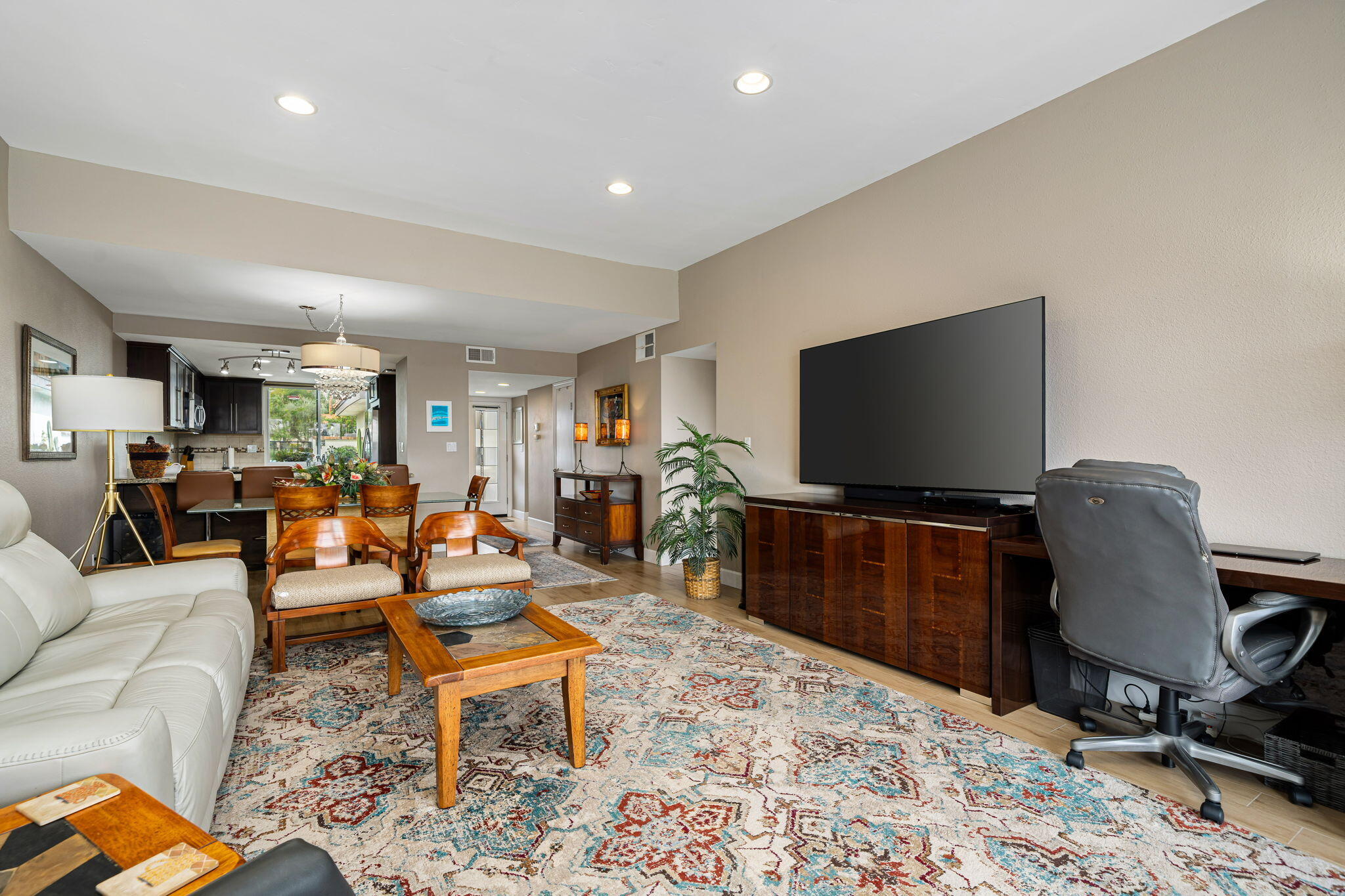 21 Toledo Drive Rancho Mirage, CA 92270 - Photo 11 of 35 a living room with furniture and a flat screen tv