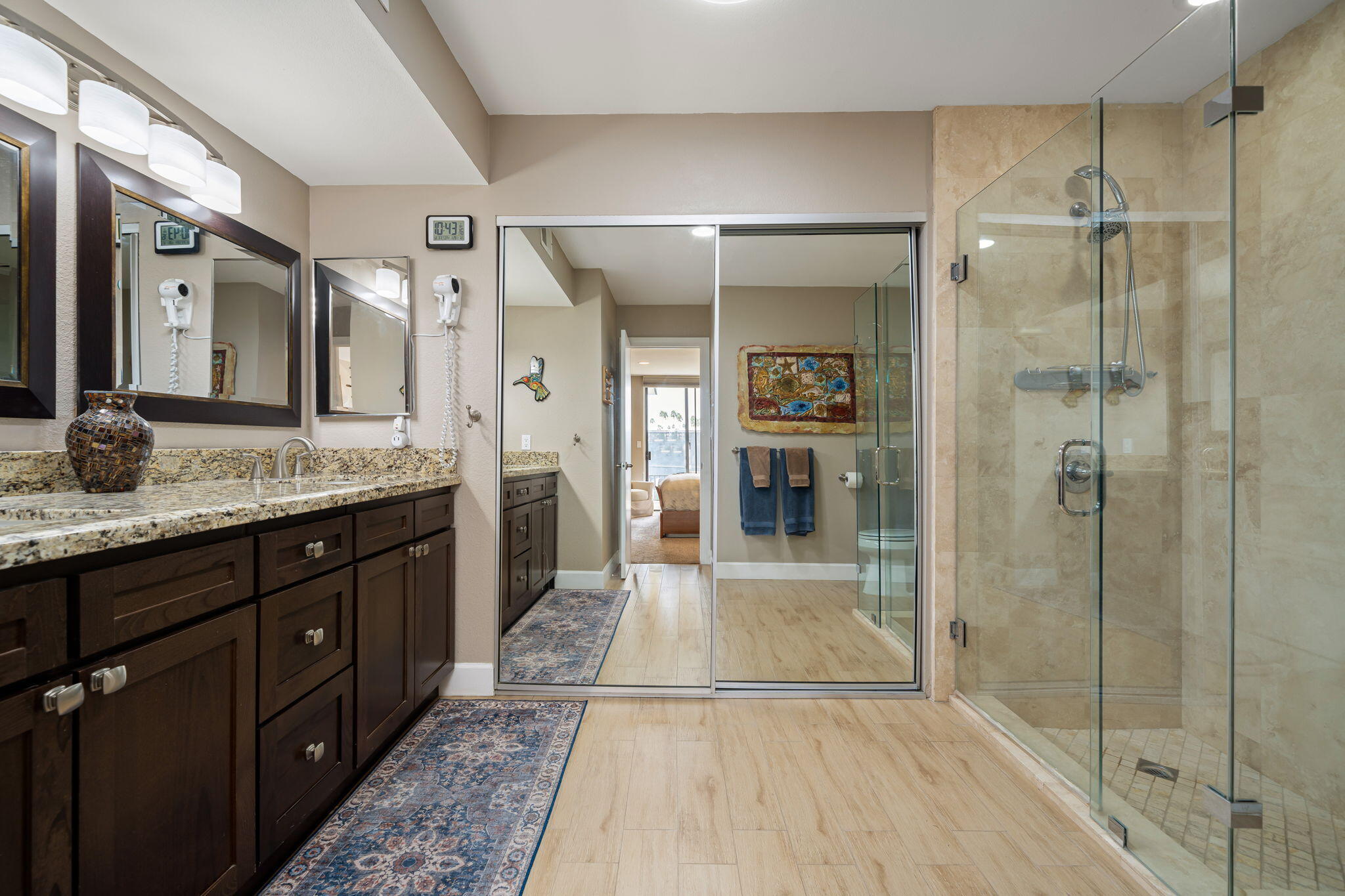 21 Toledo Drive Rancho Mirage, CA 92270 - Photo 20 of 35 a spacious bathroom with a granite countertop sink mirror and shower