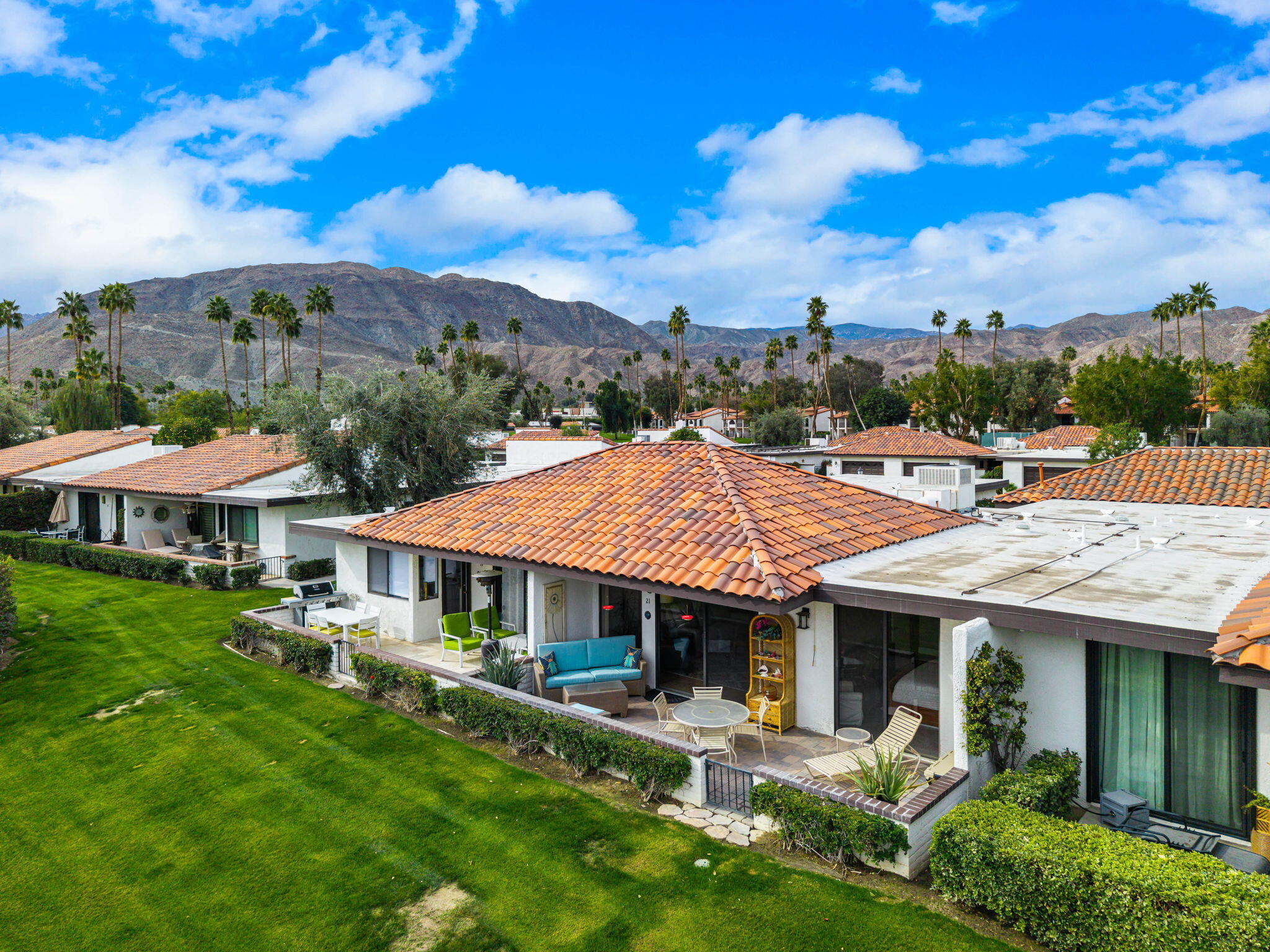 21 Toledo Drive Rancho Mirage, CA 92270 - Photo 28 of 35 a view of a house with pool and chairs
