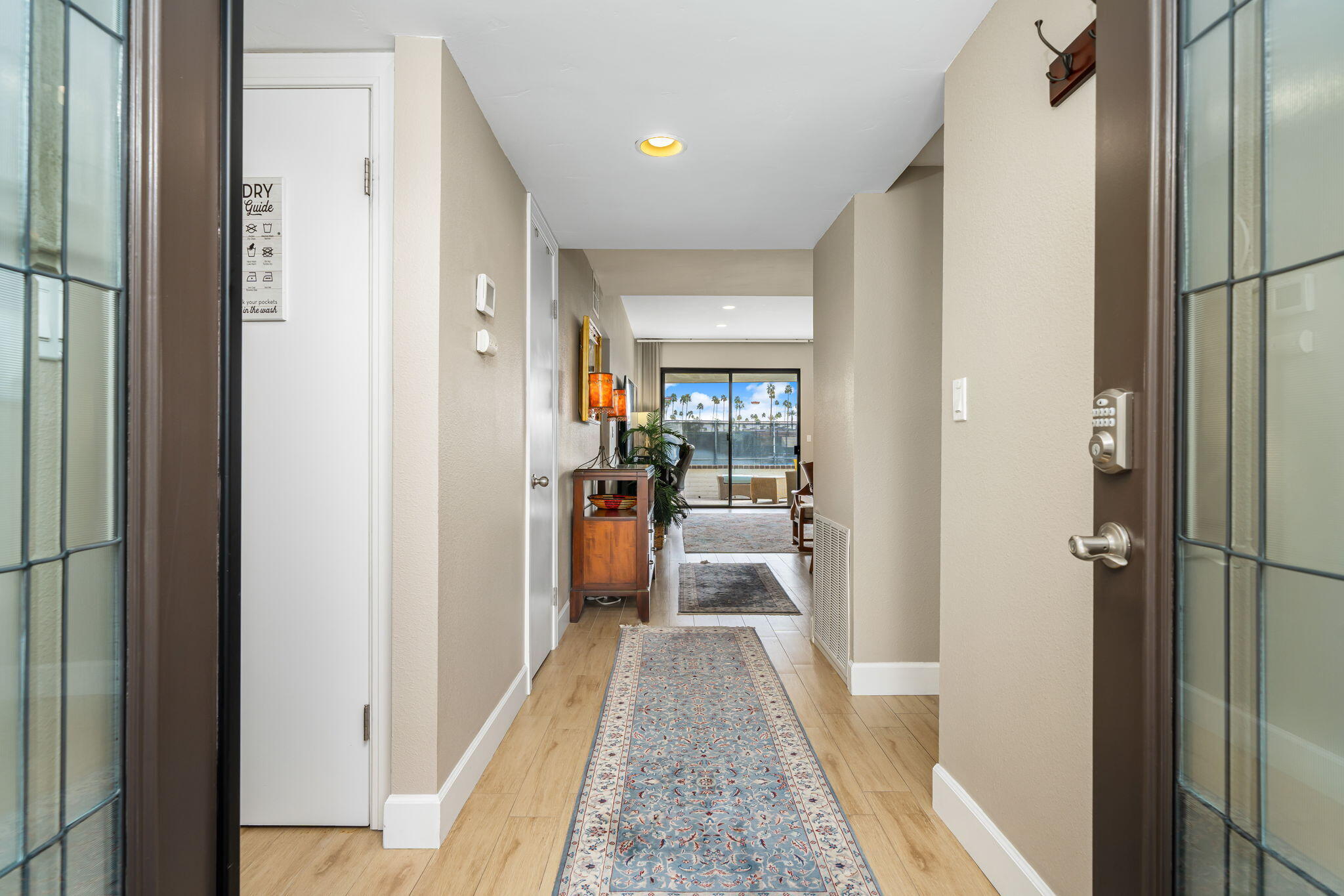 21 Toledo Drive Rancho Mirage, CA 92270 - Photo 7 of 35 a view of a hallway with a livingroom and furniture