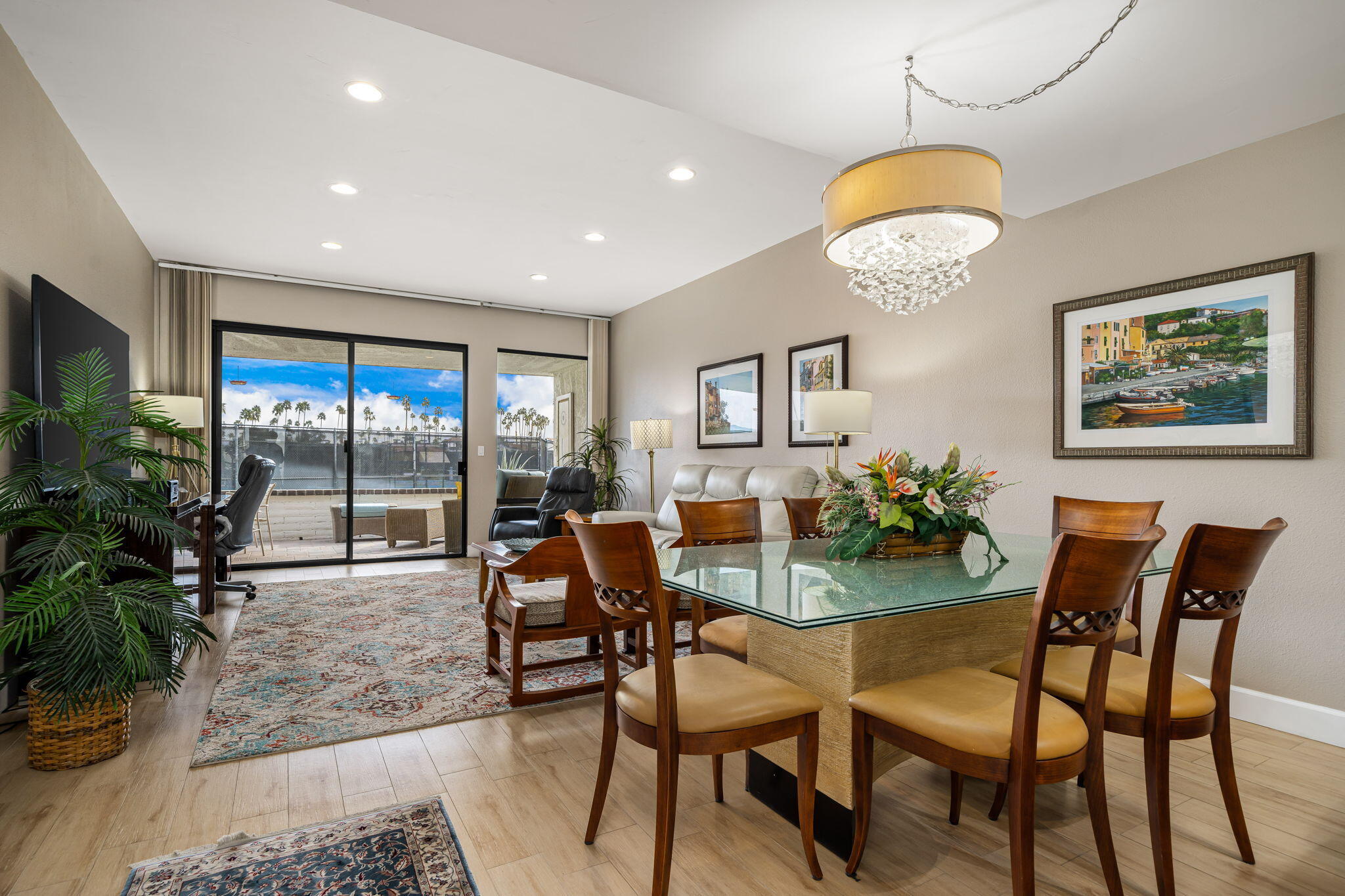21 Toledo Drive Rancho Mirage, CA 92270 - Photo 8 of 35 a view of a dining room with furniture wooden floor and a chandelier