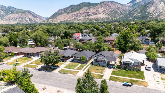2862 Fowler Avenue Ogden, UT 84403 - Photo 21 of 23 Residential neighborhood featuring established homes and mature trees against a mountain backdrop