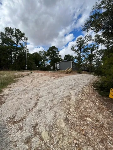 a bathroom with a bathtub and window