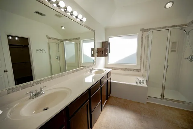 an empty room with closet and a chandelier fan