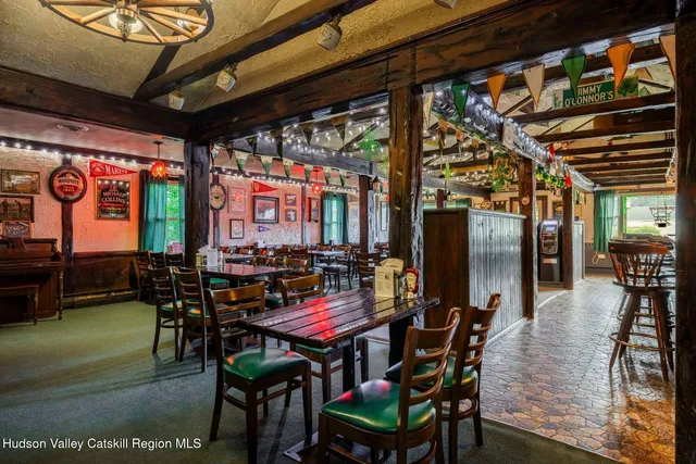 a view of a dining room with furniture and chandelier