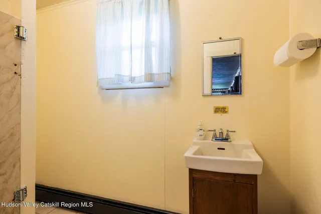 a workspace with furniture and a fan