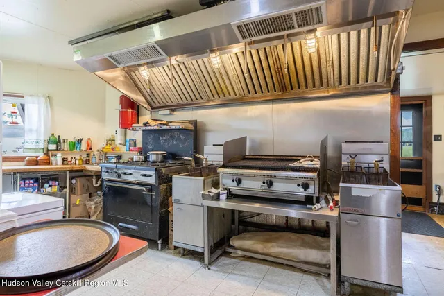 a living room with furniture a rug and a fireplace