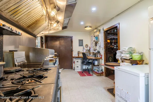 a reading room with furniture and book shelf