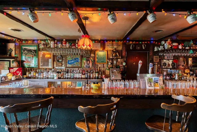 a view of a big dining room with many windows