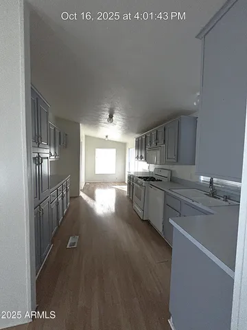 a kitchen with counter top space and stainless steel appliances