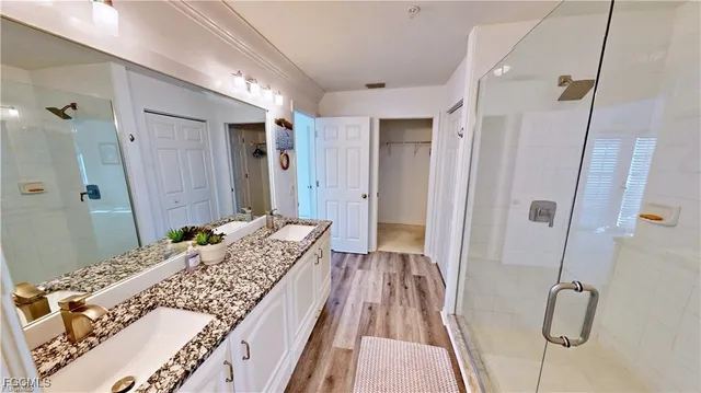 a bedroom with a bed and a shower