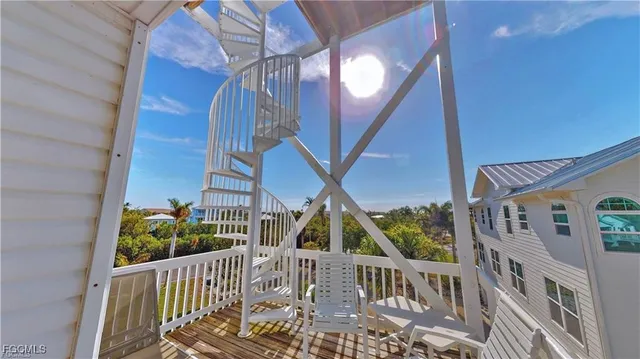 a view of balcony with deck and wooden floor