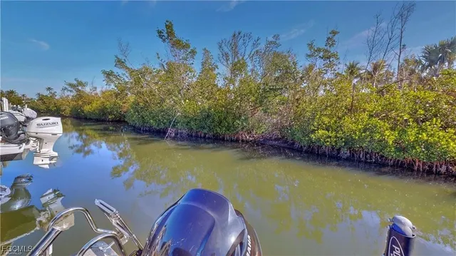 a view of a swimming pool with an outdoor space and seating area