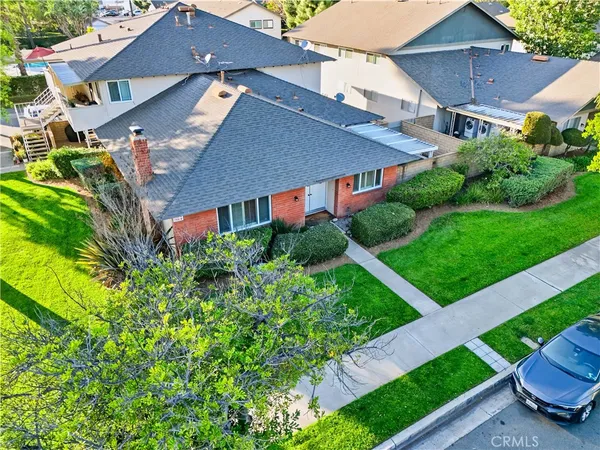 a view of a house with a yard and plants