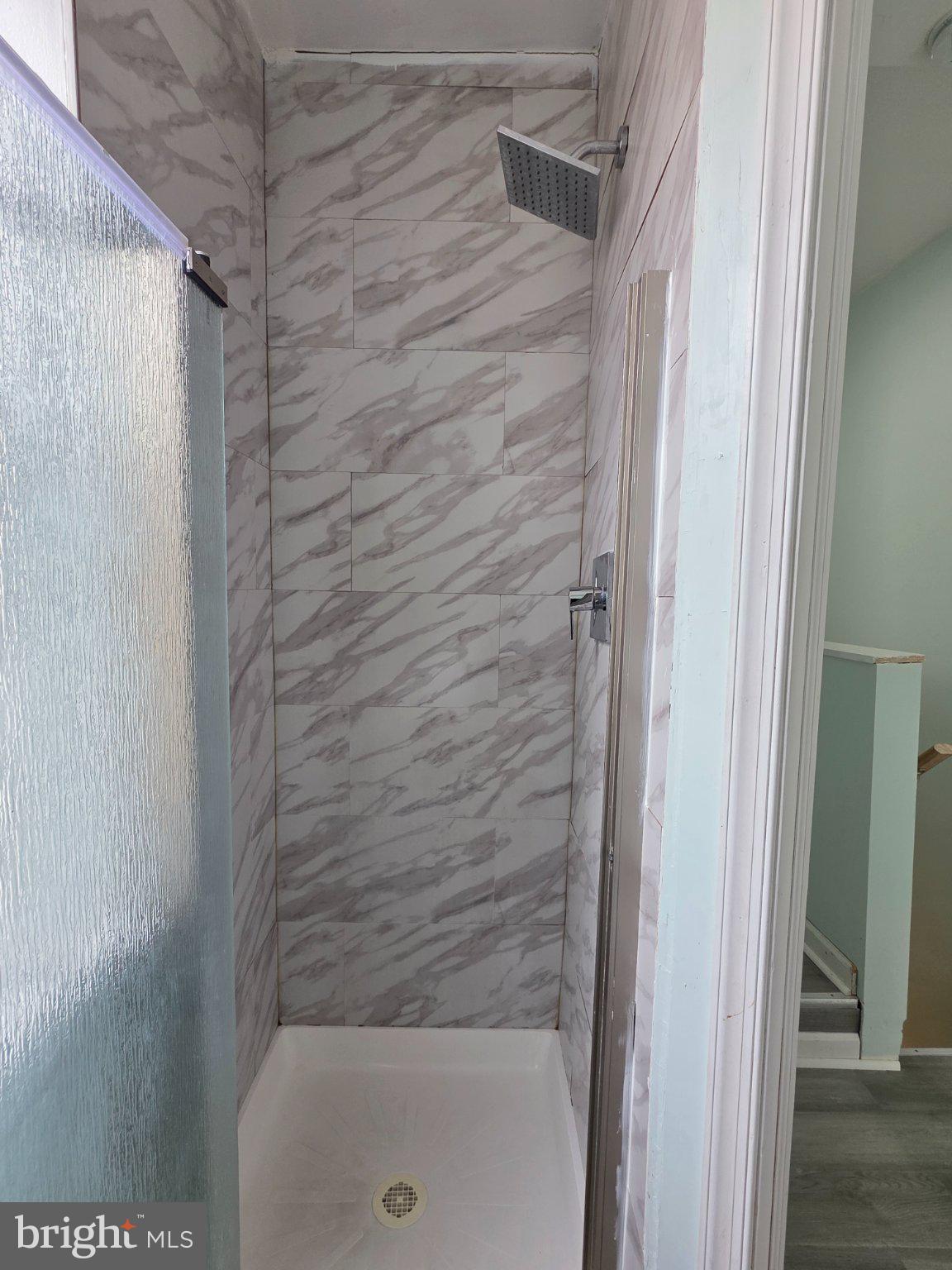 1864 North Uber Street Philadelphia, PA 19121 - Photo 22 of 29 Sleek modern shower with elegant tiles.