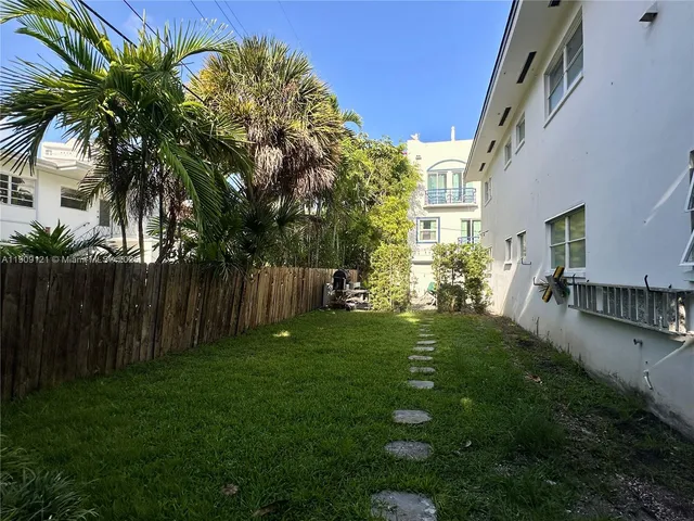 a backyard of a house with lots of green space