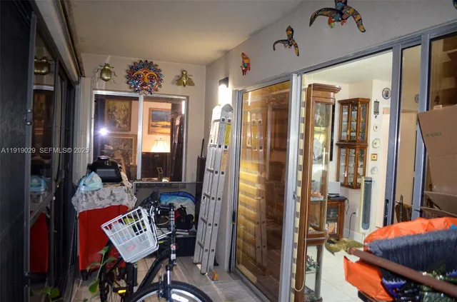 a view of a livingroom with furniture and a window