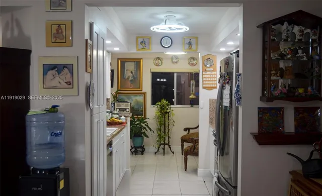 a view of a hallway with dining area