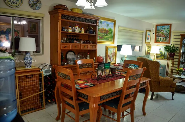a dining room with furniture and window