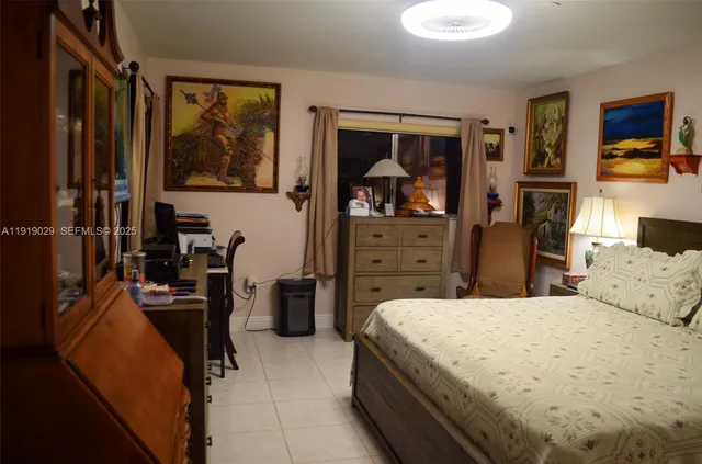 a bedroom with a bed and furniture