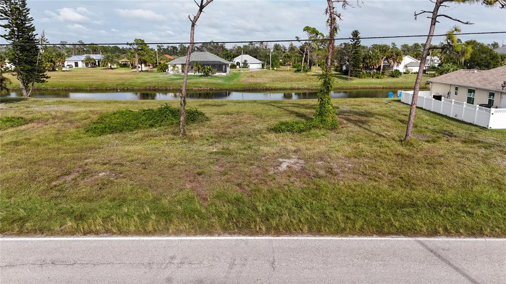 763 Rotonda Circle Rotonda West, FL 33947 - Photo 4 of 5 a view of a lake with houses