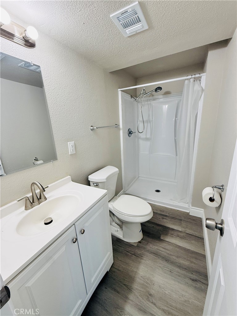 35010 Cedar Road Barstow, CA 92311 - Photo 9 of 14 a bathroom with a toilet sink and shower