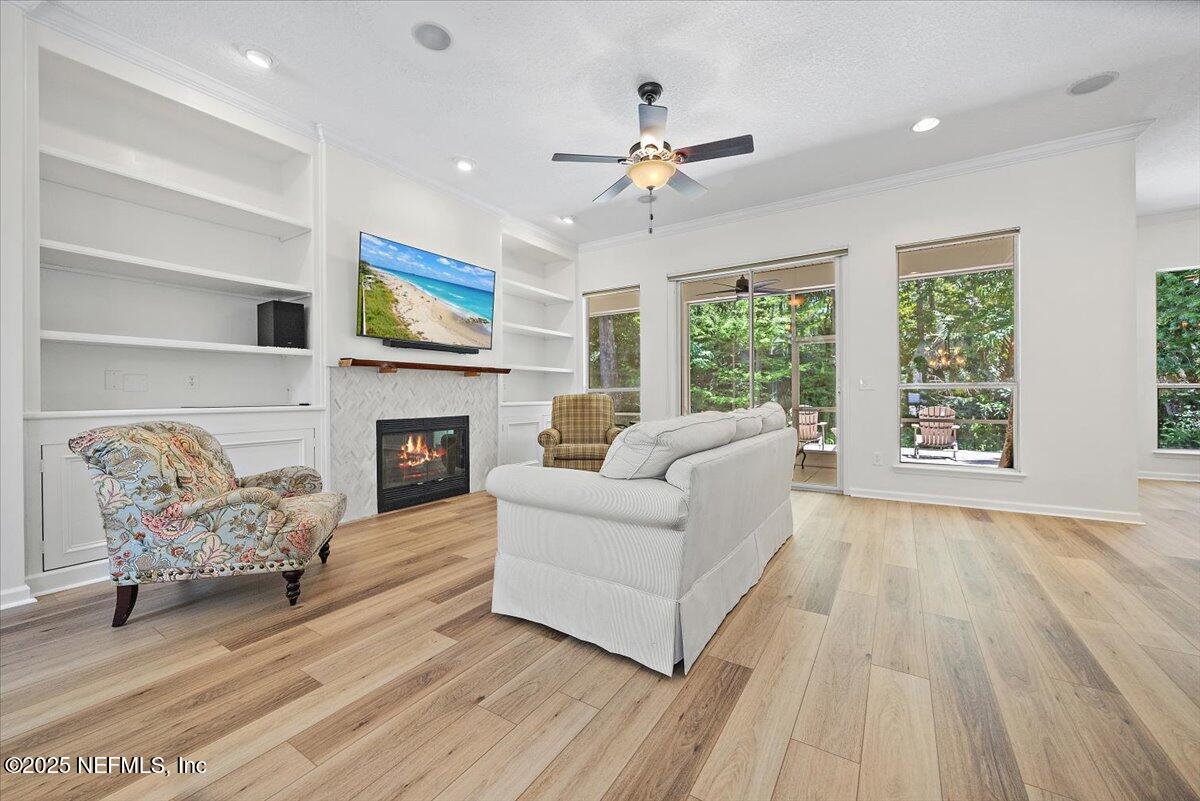 840 Mill Stream Road Ponte Vedra Beach, FL 32082 - Photo 6 of 29 a living room with furniture and a fireplace