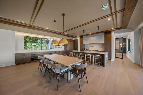 a kitchen with a table and chairs in it