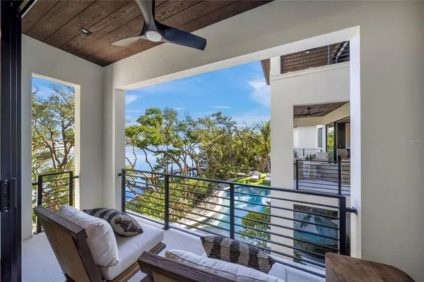 a view of a balcony with chairs