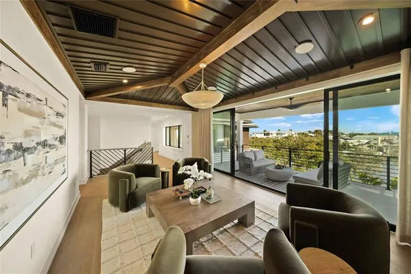 a bedroom with a bed wooden floor and window
