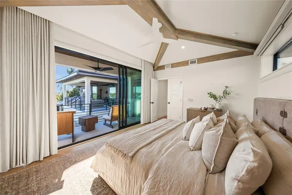 a view of a chairs and table in the balcony