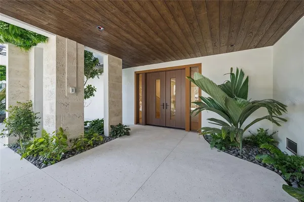 a house with a plant in front of it