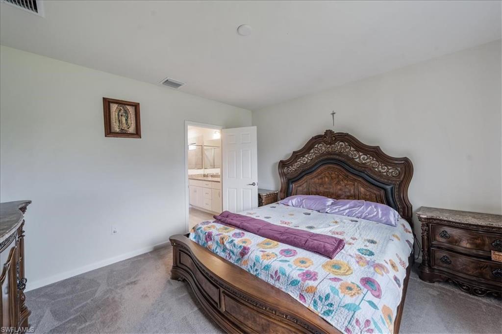 4596 Lamaida Lane Immokalee, FL 34142 - Photo 14 of 22 a bedroom with a bed and a window