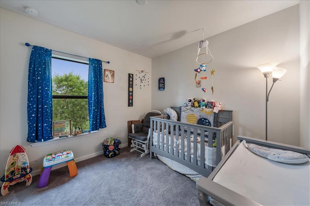 4596 Lamaida Lane Immokalee, FL 34142 - Photo 15 of 22 a bedroom with furniture a baby crib and a window