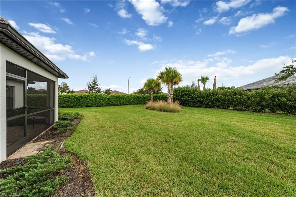 4596 Lamaida Lane Immokalee, FL 34142 - Photo 18 of 22 a view of an outdoor space and a yard
