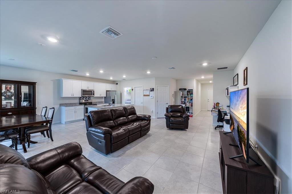 4596 Lamaida Lane Immokalee, FL 34142 - Photo 2 of 22 a living room with furniture and a flat screen tv