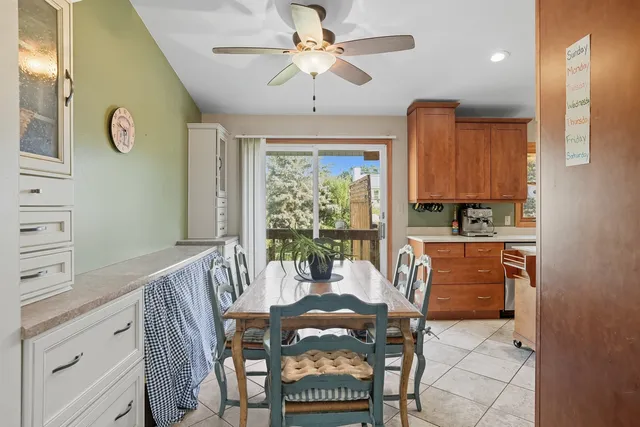 a view of a dining room with furniture window and outside view