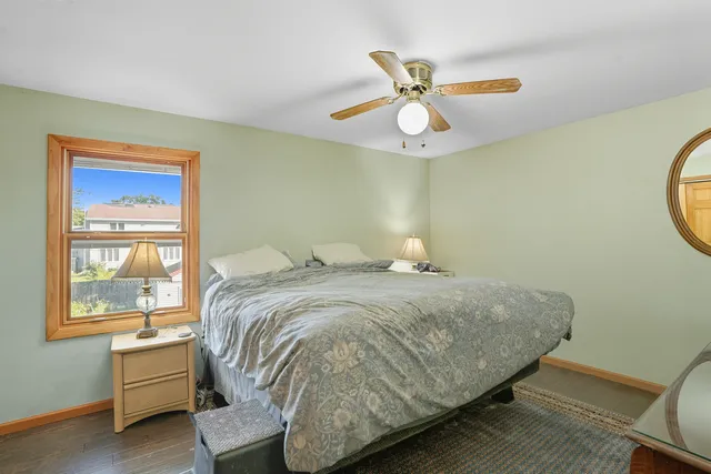 a bedroom with a bed and window