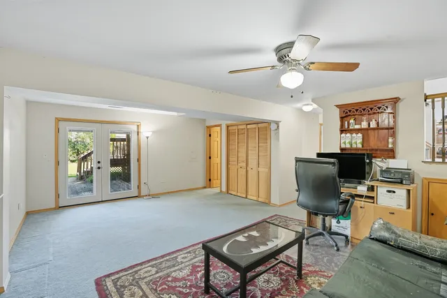 a view of a livingroom with furniture and a window