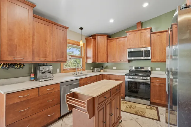 a kitchen with a sink stove and refrigerator