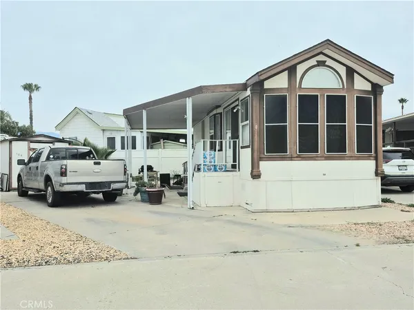 a view of a car park in front of house