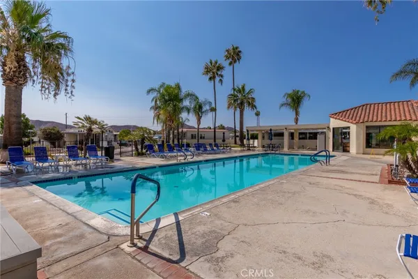 a view of a swimming pool with a patio