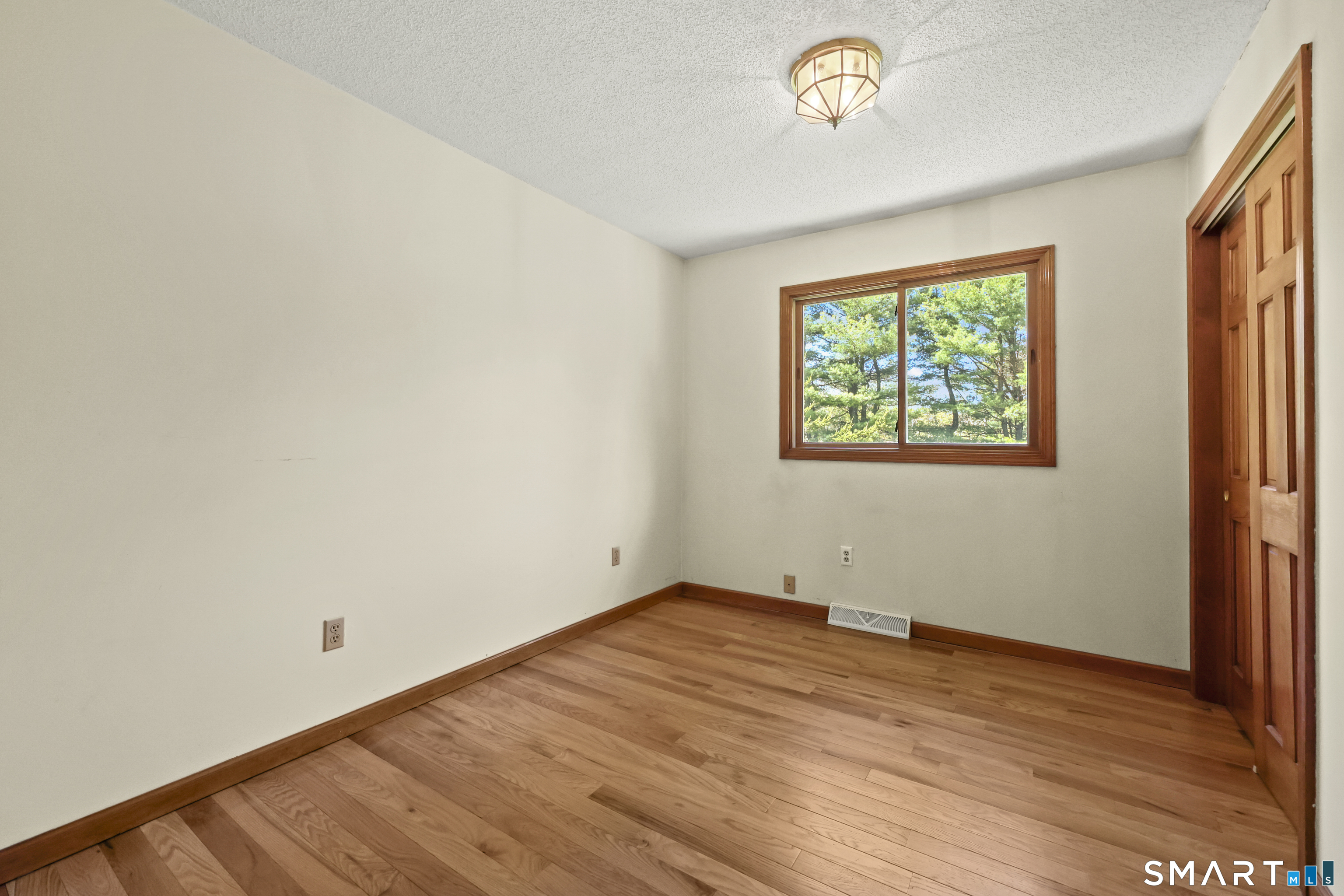 419 Birge Park Road Harwinton, CT 06791 - Photo 11 of 36 an empty room with a window