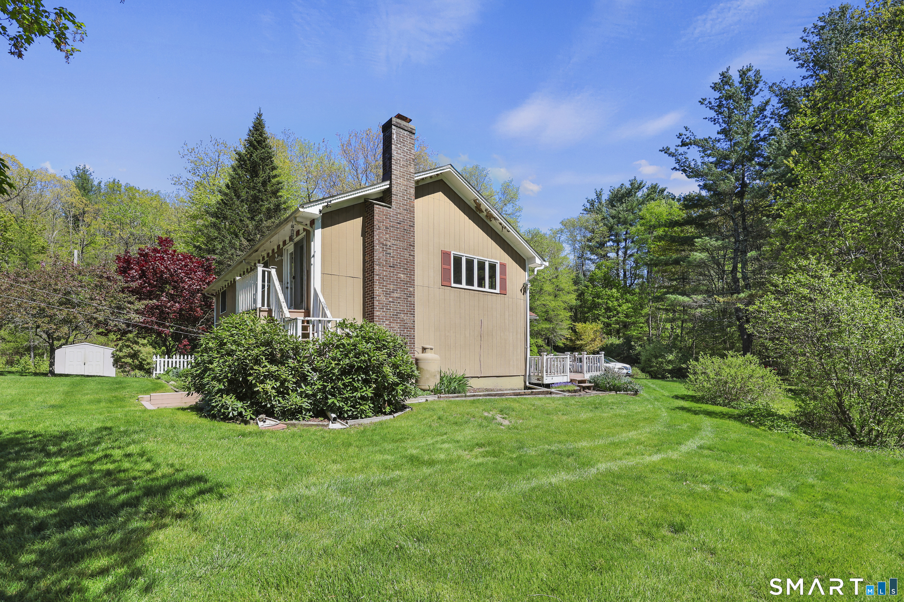 419 Birge Park Road Harwinton, CT 06791 - Photo 26 of 36 a front view of a house with a yard and trees