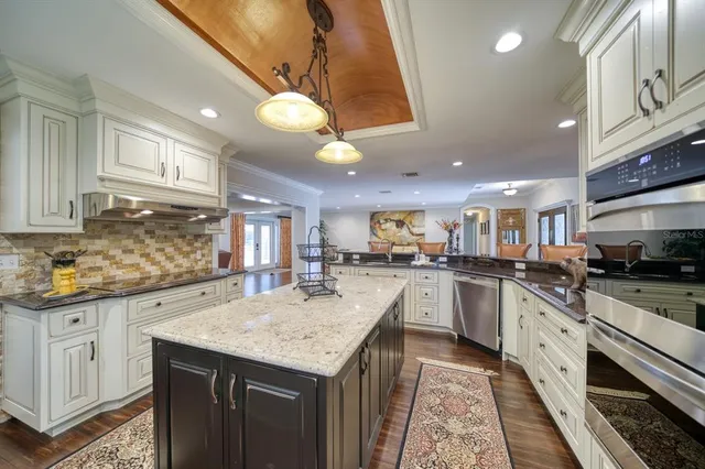 a kitchen with granite countertop lots of counter top space