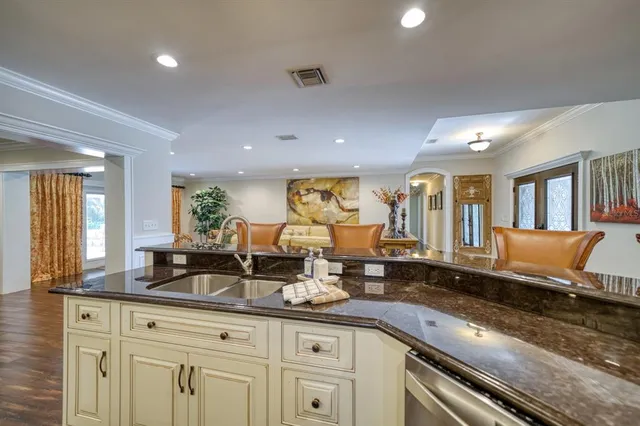 a large kitchen with lots of counter space and windows