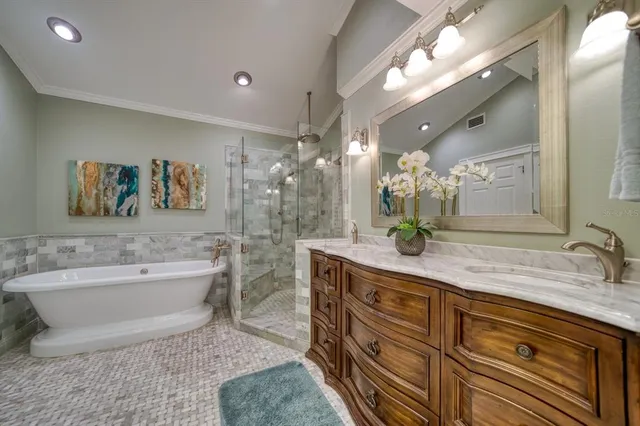 a spacious bathroom with a granite countertop sink a toilet a mirror and bathtub